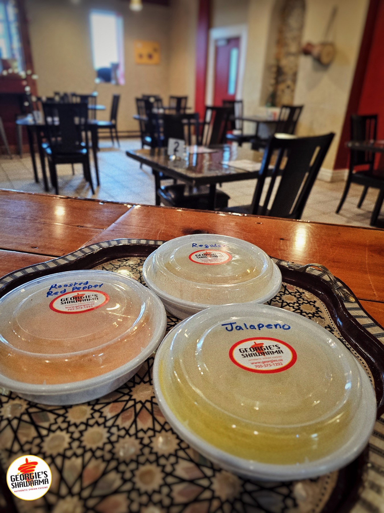 Georgie's hummus containers on a table
