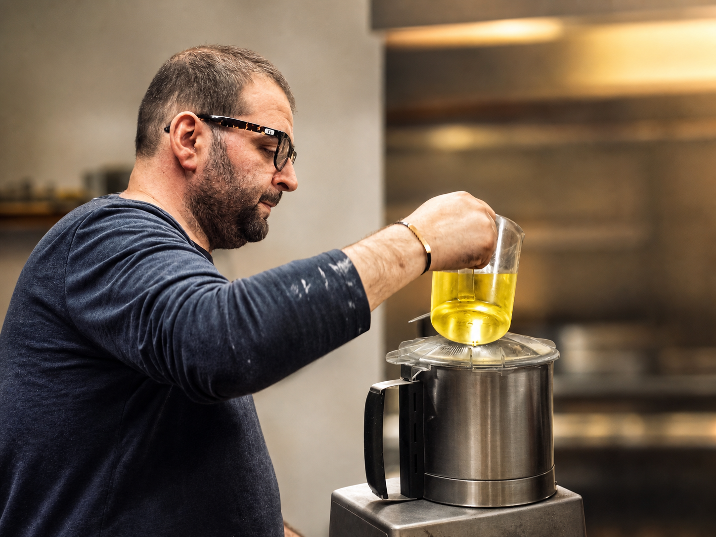 George preparing food in Georgie's kitchen.